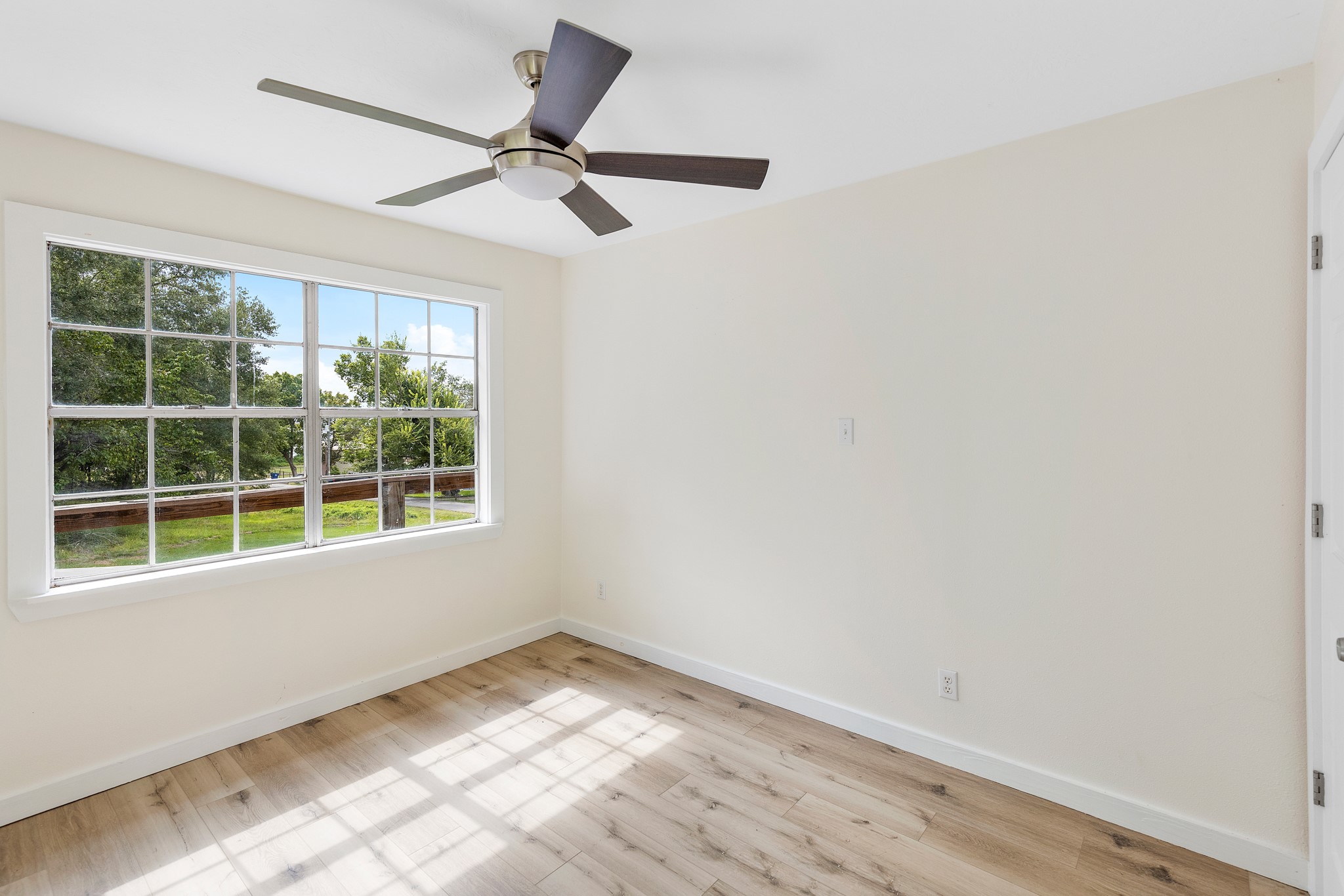 161 White Oak Street Point Blank, TX 77364 - Photo 14 of 23 an empty room with a window