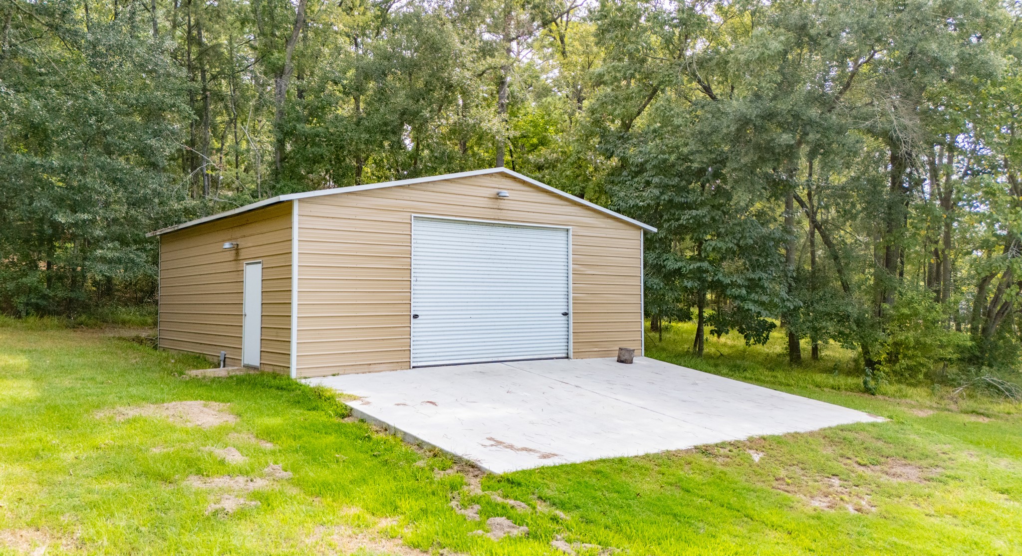 161 White Oak Street Point Blank, TX 77364 - Photo 20 of 23 a front view of a house with a garden