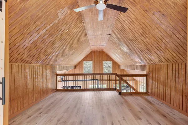 a view of a balcony with wooden floor