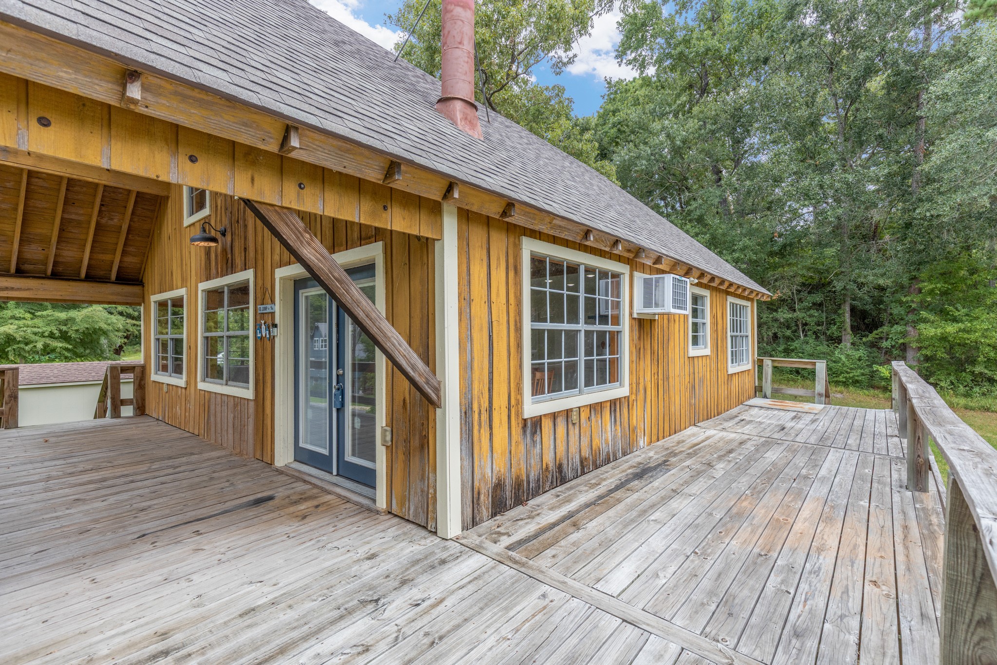 161 White Oak Street Point Blank, TX 77364 - Photo 6 of 23 a view of backyard with deck and wooden floor