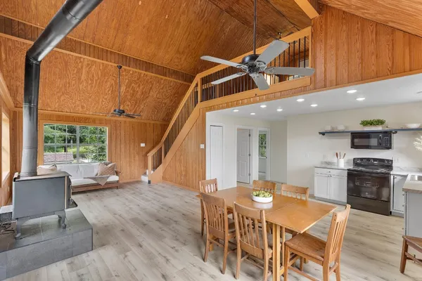a living room with furniture and large windows