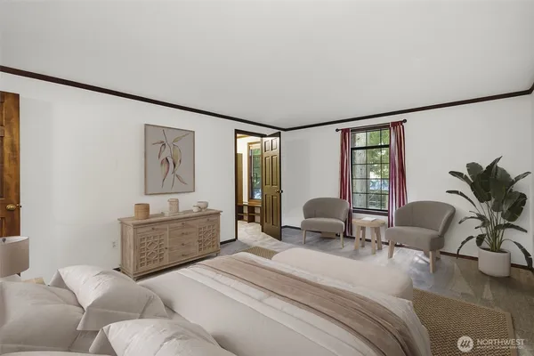 a bedroom with a bed furniture and a large window