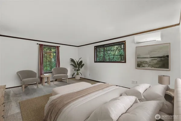 a bedroom with a bed and glass window