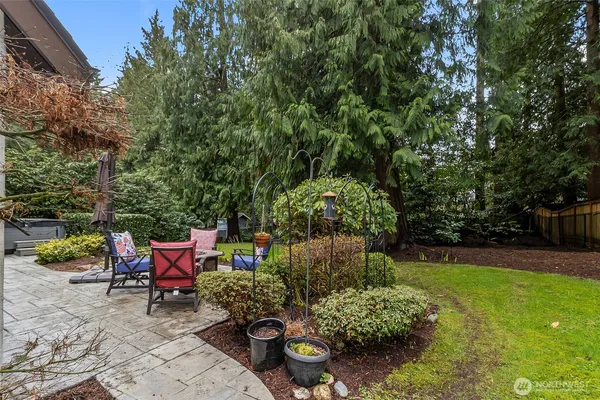 a backyard of a house with outdoor seating