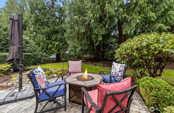 a view of a chairs and table in the patio