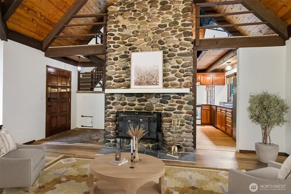 a view of a livingroom with furniture and fireplace