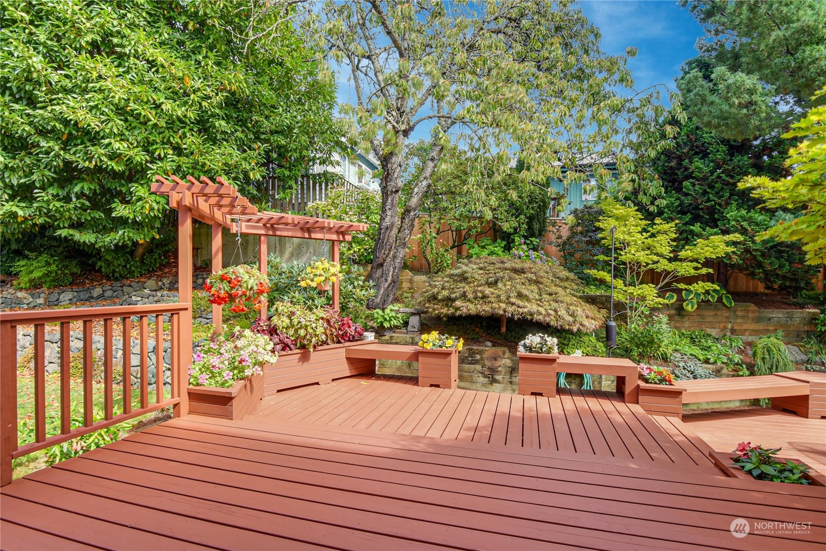 1310 North 41st Street, Unit B Seattle, WA 98103 - Photo 12 of 40 a view of a deck with chairs and wooden floor