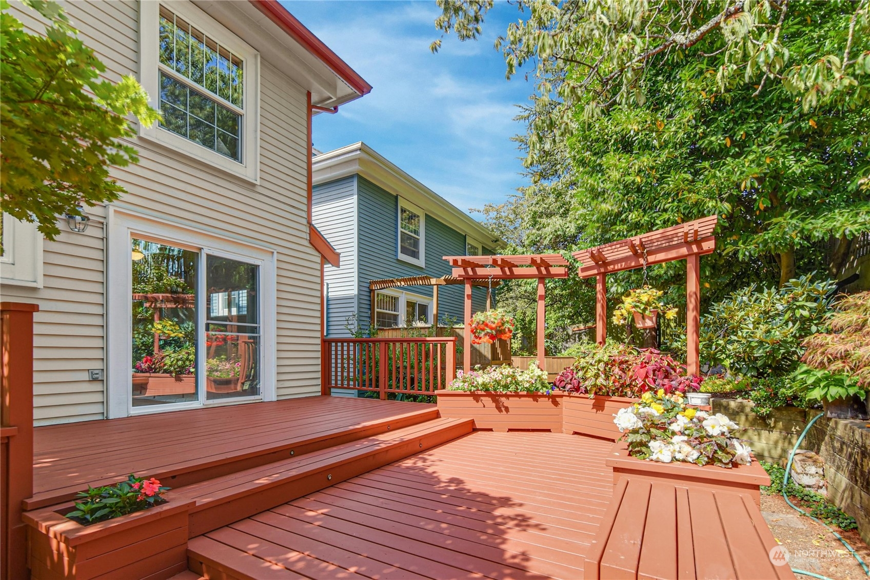 1310 North 41st Street, Unit B Seattle, WA 98103 - Photo 13 of 40 a view of house with wooden floor and potted plants
