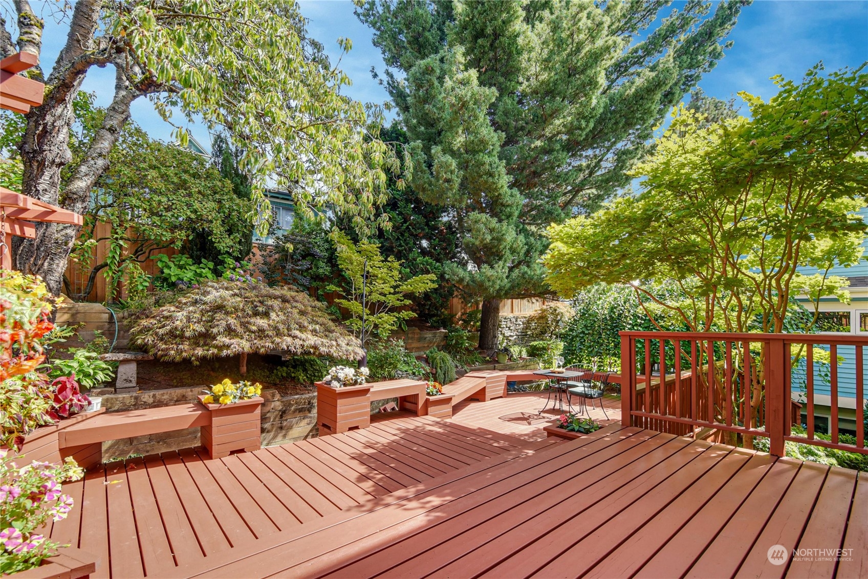 1310 North 41st Street, Unit B Seattle, WA 98103 - Photo 14 of 40 a view of a wooden deck with chairs