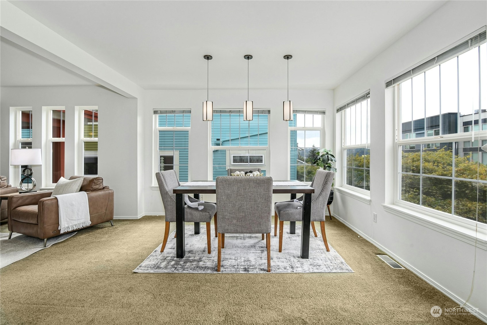 1310 North 41st Street, Unit B Seattle, WA 98103 - Photo 17 of 40 a view of a dining room with furniture window and outside view