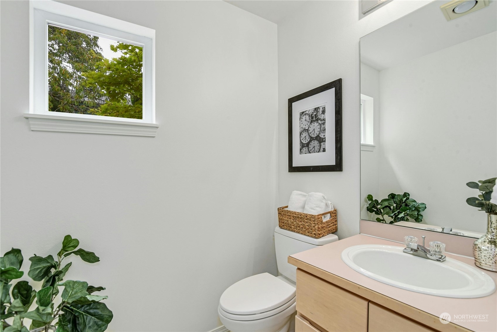 1310 North 41st Street, Unit B Seattle, WA 98103 - Photo 19 of 40 a bathroom with a toilet a sink and a window