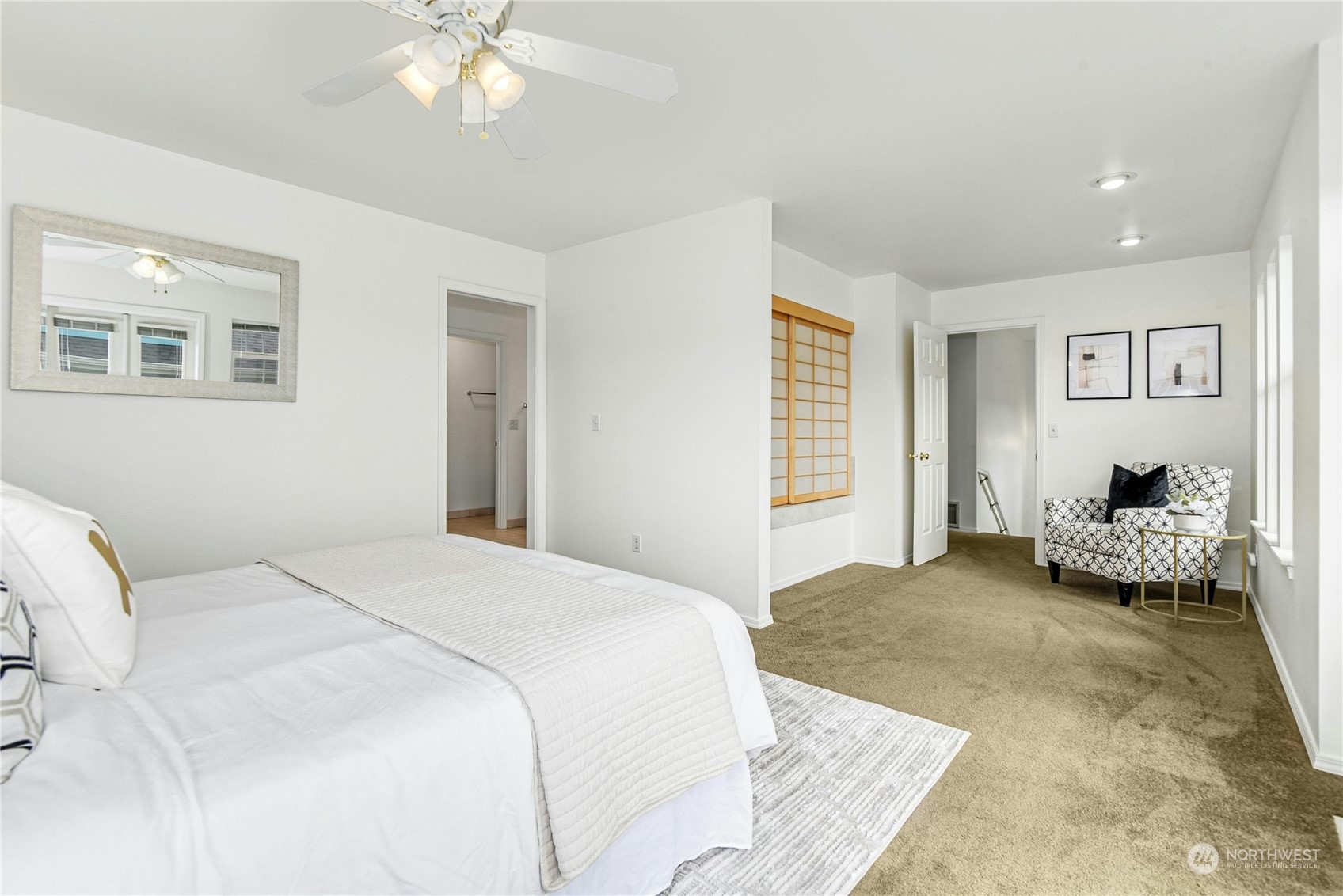 1310 North 41st Street, Unit B Seattle, WA 98103 - Photo 20 of 40 a spacious bedroom with a bed and a chandelier