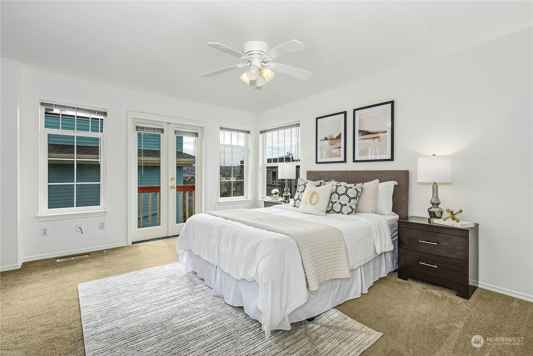 1310 North 41st Street, Unit B Seattle, WA 98103 - Photo 21 of 40 a spacious bedroom with a large bed and a large window