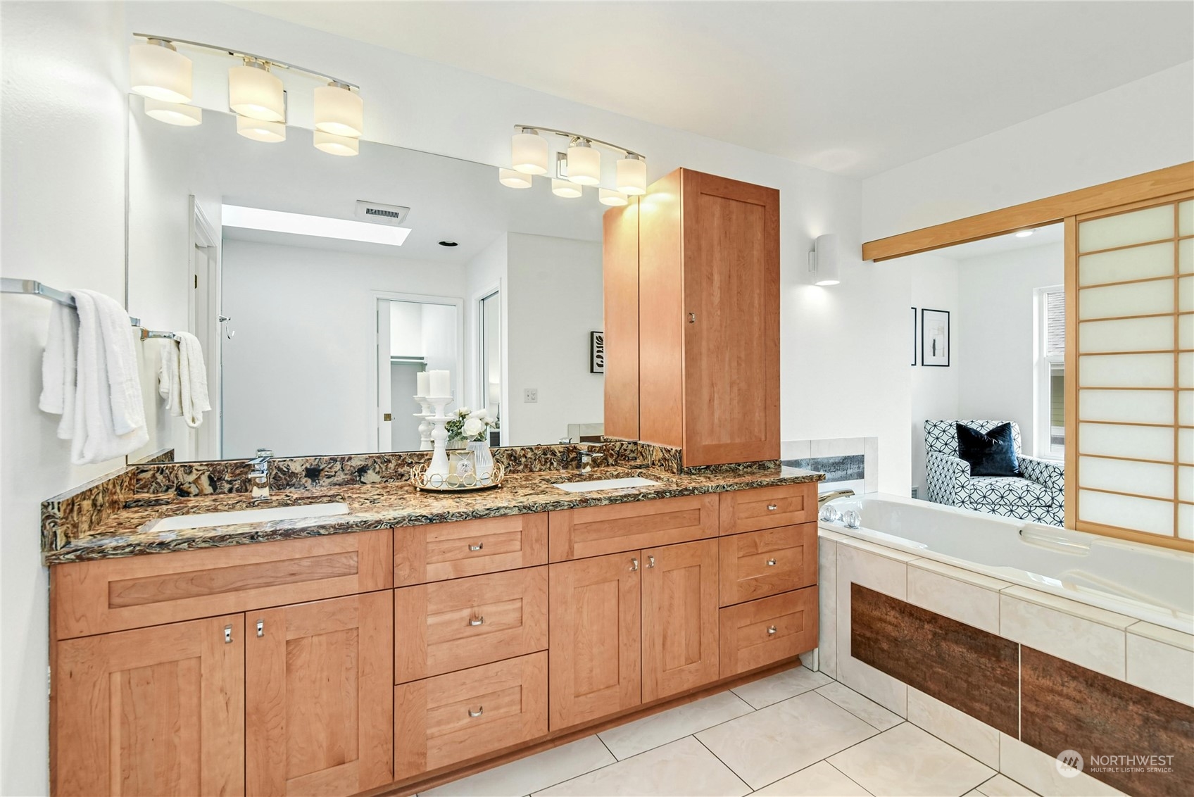 1310 North 41st Street, Unit B Seattle, WA 98103 - Photo 22 of 40 a spacious bathroom with a granite countertop double vanity sink mirror bathtub and shower