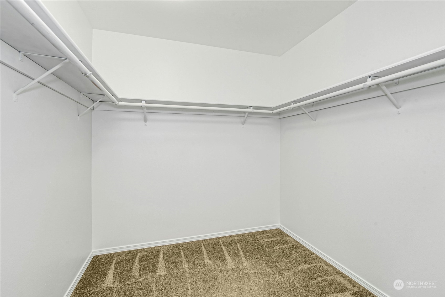 1310 North 41st Street, Unit B Seattle, WA 98103 - Photo 25 of 40 a view of walk in closet with empty racks