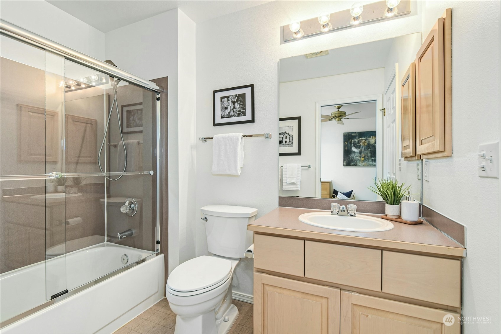 1310 North 41st Street, Unit B Seattle, WA 98103 - Photo 28 of 40 a bathroom with a sink toilet and shower