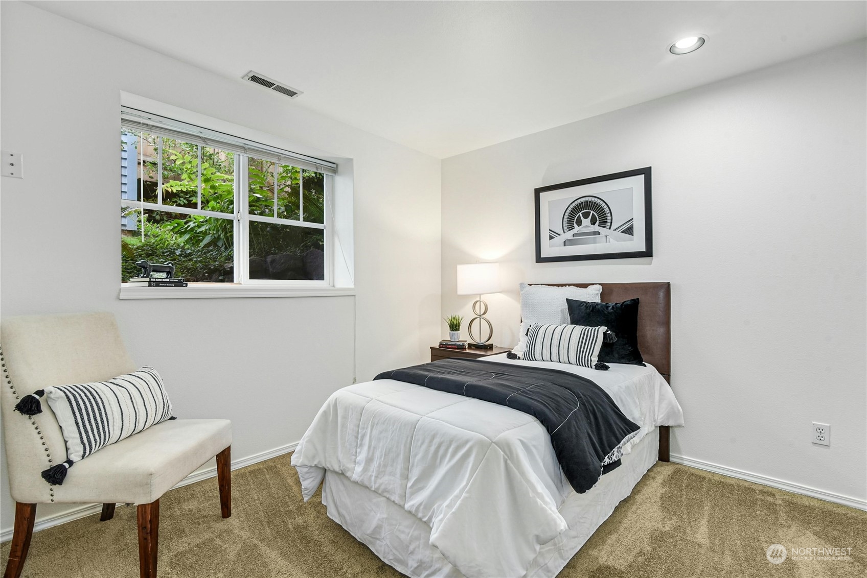 1310 North 41st Street, Unit B Seattle, WA 98103 - Photo 30 of 40 a bedroom with a bed and a chair