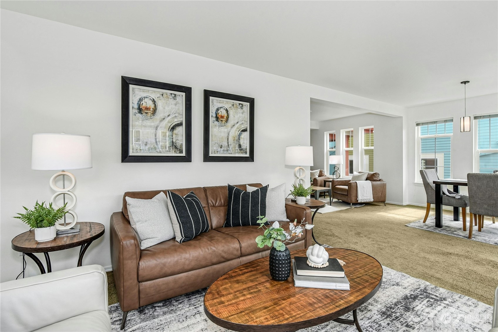 1310 North 41st Street, Unit B Seattle, WA 98103 - Photo 5 of 40 a living room with furniture couches and a dining table with wooden floor