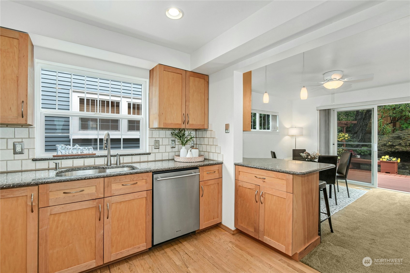 1310 North 41st Street, Unit B Seattle, WA 98103 - Photo 10 of 40 a kitchen with cabinets a sink and appliances