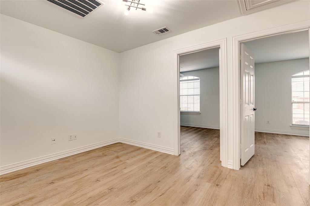 5713 Butterfly Way Fairview, TX 75069 - Photo 17 of 32 an empty room with wooden floor and windows