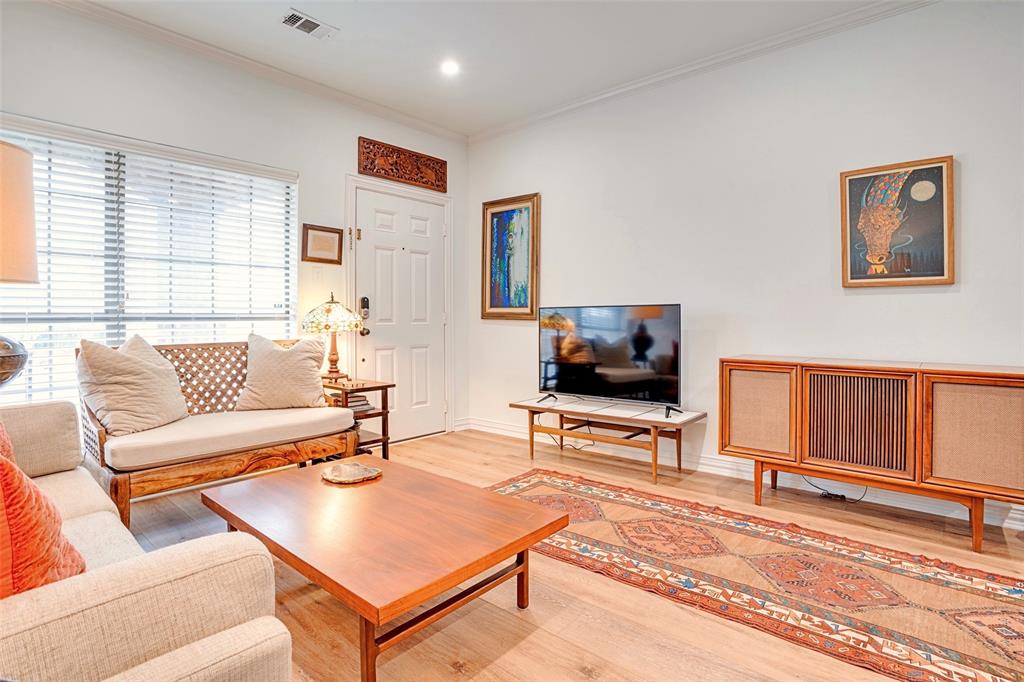 5713 Butterfly Way Fairview, TX 75069 - Photo 4 of 32 a living room with furniture a flat screen tv and a window