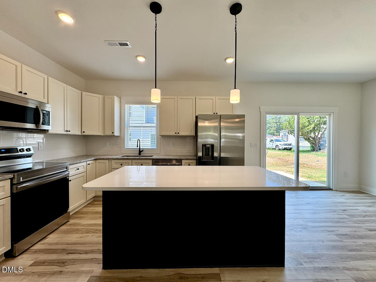 218 George Street Four Oaks, NC 27524 - Photo 8 of 33 Kitchen Island + Pantry View