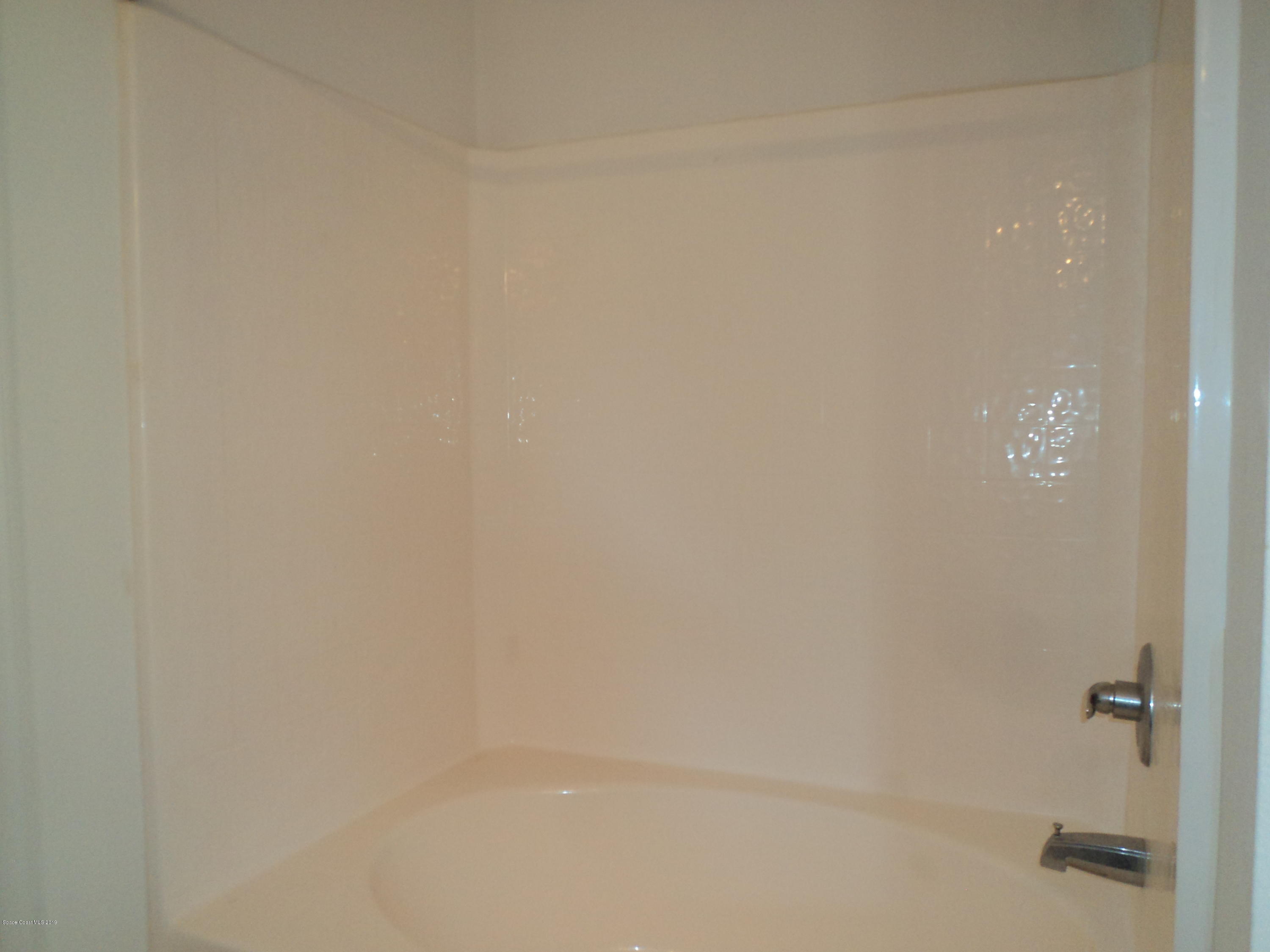 1685 Wacker Avenue Southeast Palm Bay, FL 32909 - Photo 13 of 30 a close up of a shower