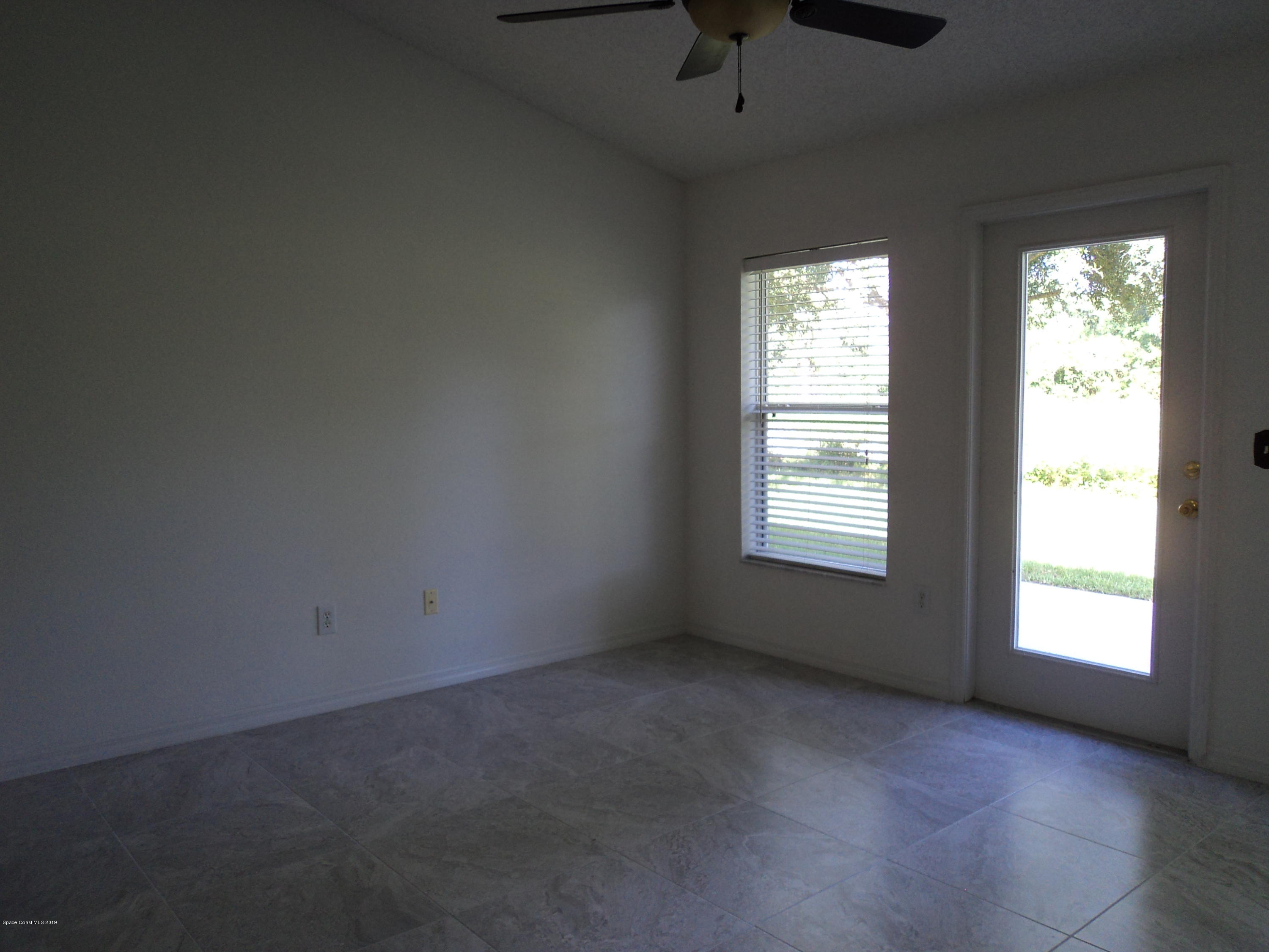 1685 Wacker Avenue Southeast Palm Bay, FL 32909 - Photo 16 of 30 a view of an empty room with a window