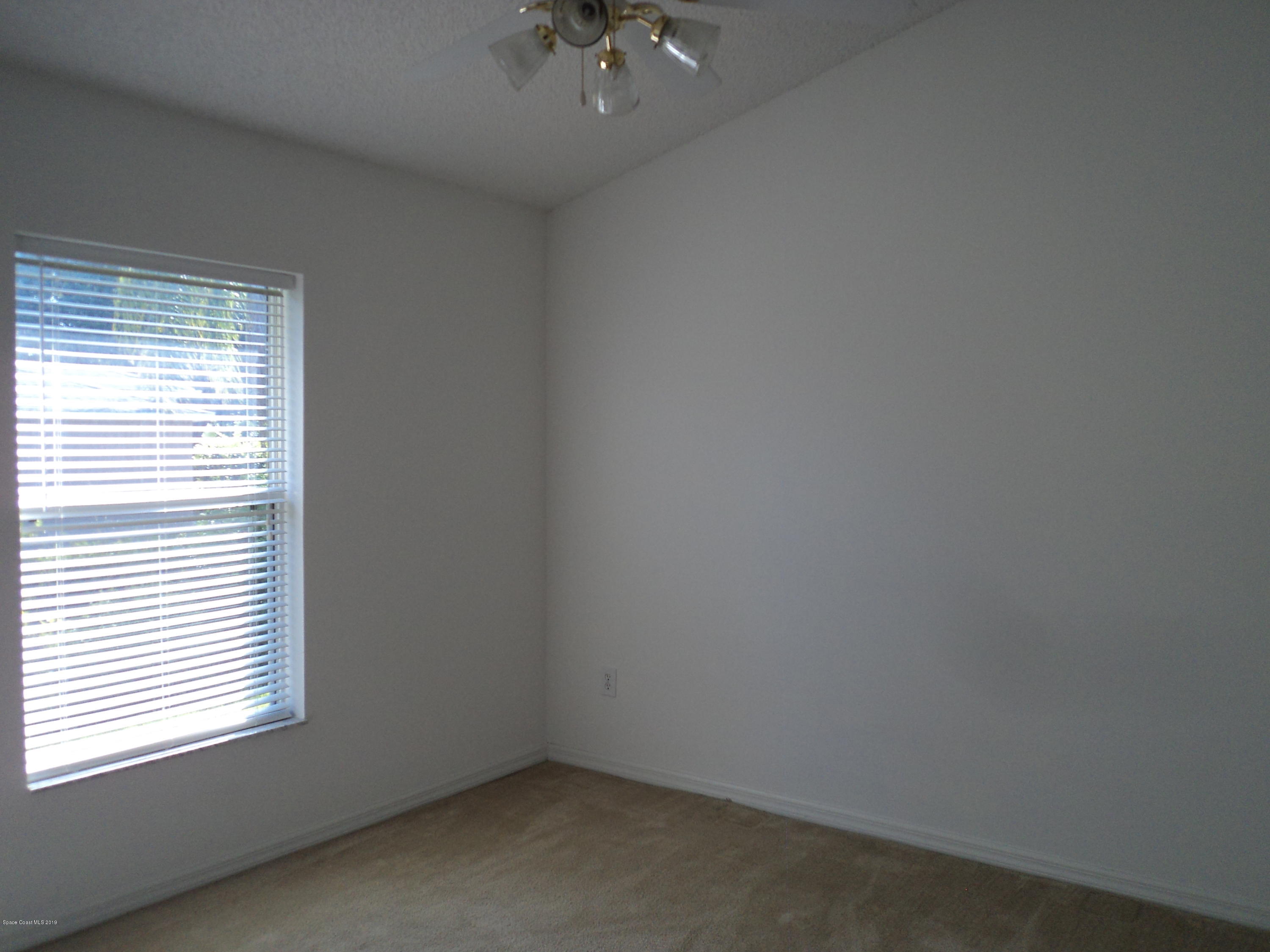 1685 Wacker Avenue Southeast Palm Bay, FL 32909 - Photo 19 of 30 an empty room with a window