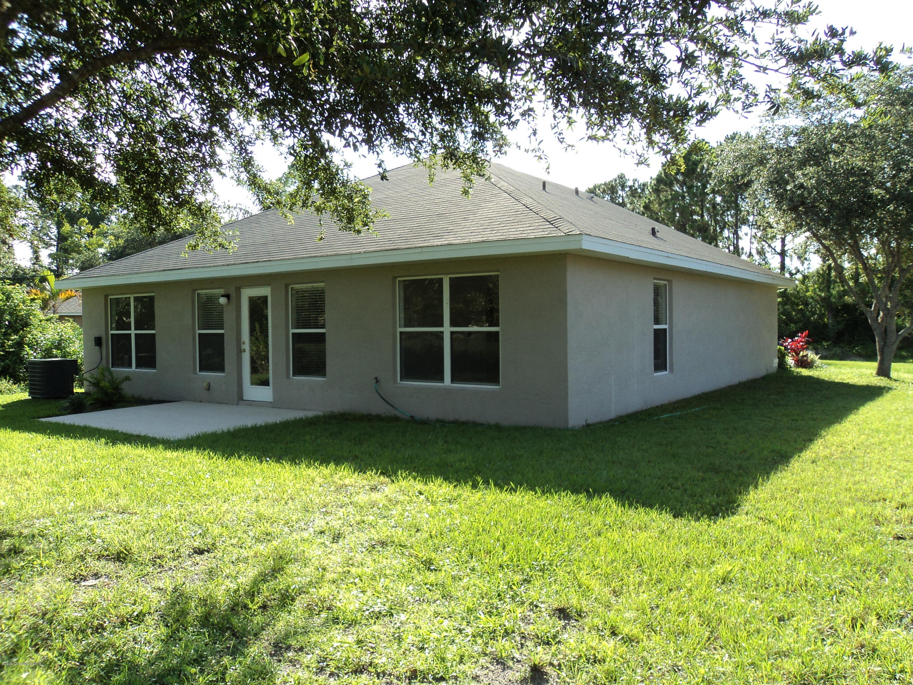 1685 Wacker Avenue Southeast Palm Bay, FL 32909 - Photo 26 of 30 a view of a backyard with a garden