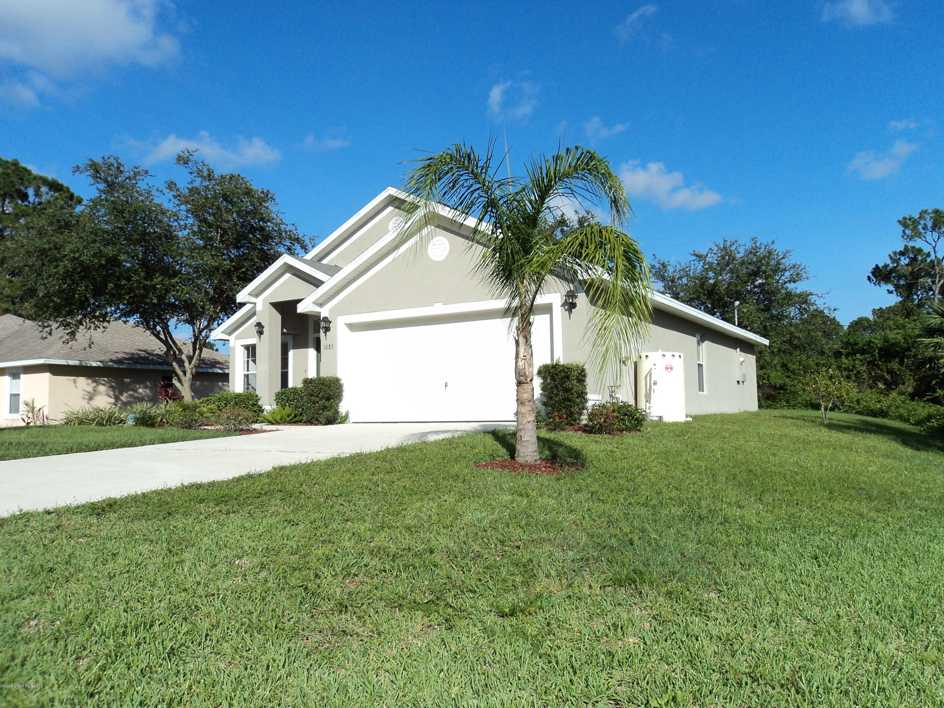 1685 Wacker Avenue Southeast Palm Bay, FL 32909 - Photo 29 of 30 a house view with a garden space