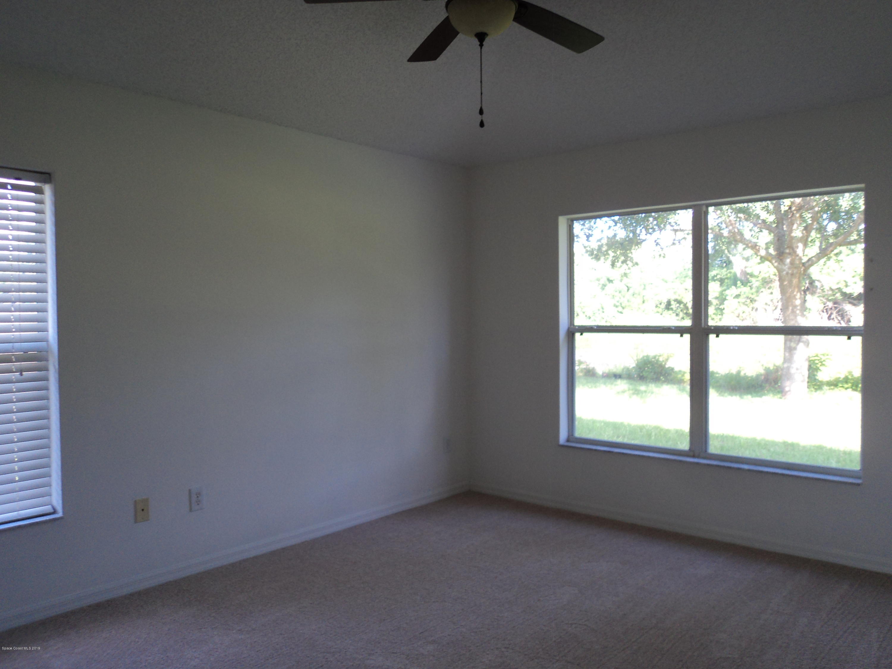 1685 Wacker Avenue Southeast Palm Bay, FL 32909 - Photo 5 of 30 an empty room with a window