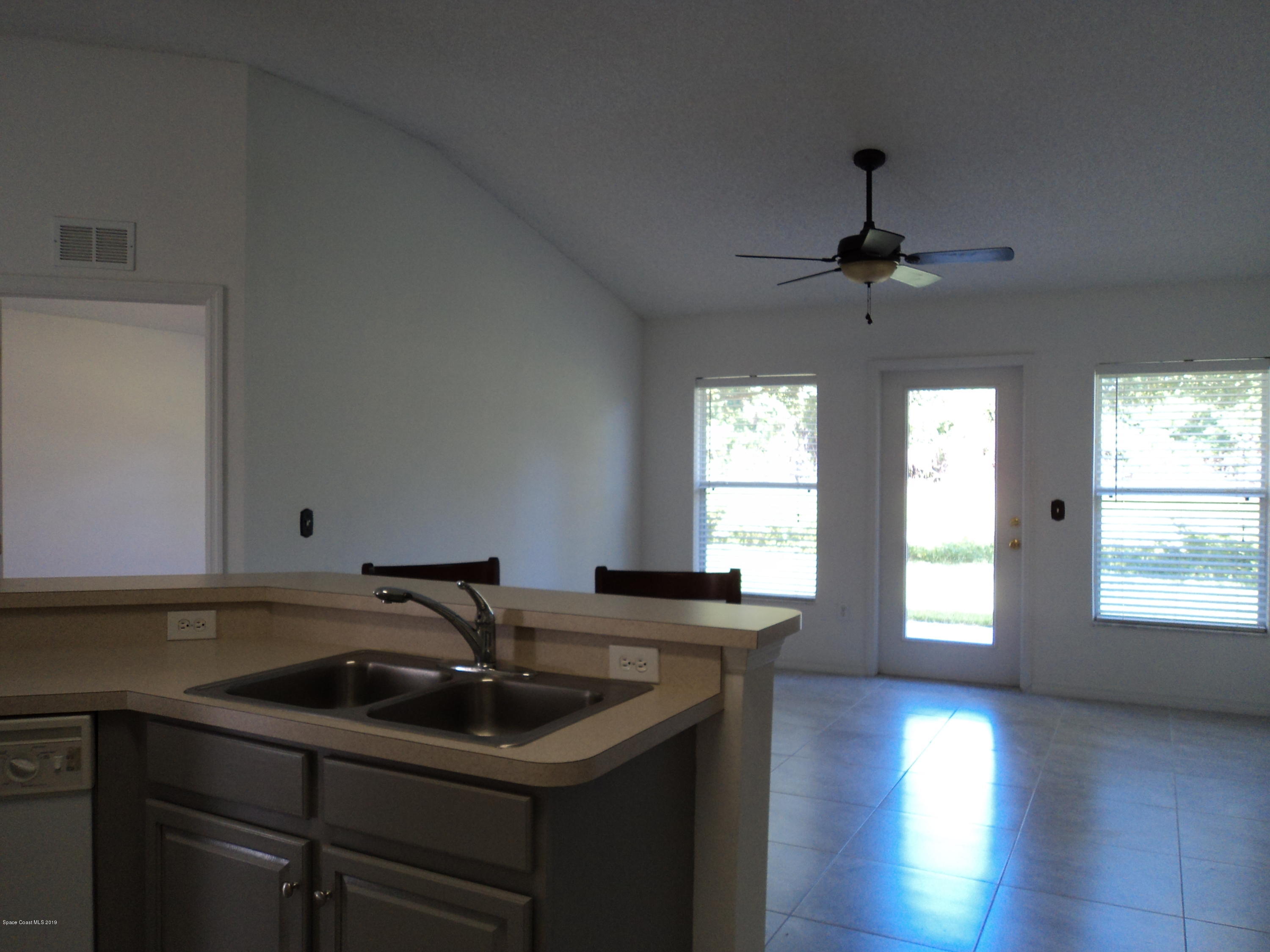 1685 Wacker Avenue Southeast Palm Bay, FL 32909 - Photo 7 of 30 a bathroom with a sink and a window