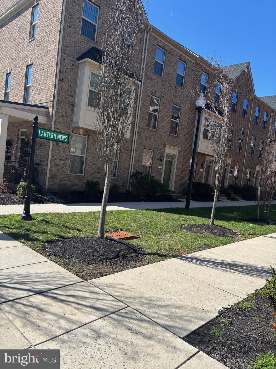 1728 Lantern Mews Baltimore, MD 21205 - Photo 2 of 16 a front view of a house with garden