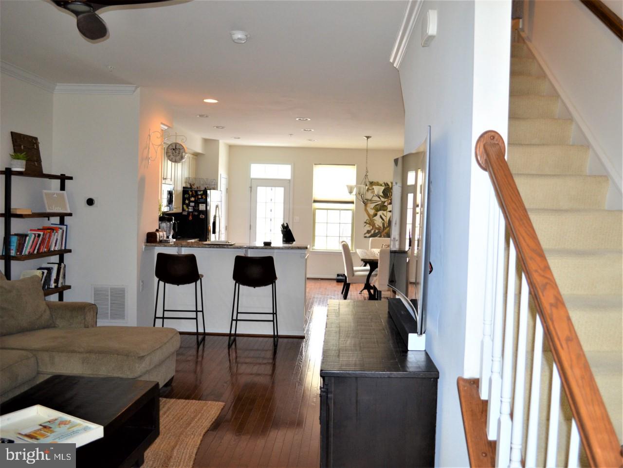 1728 Lantern Mews Baltimore, MD 21205 - Photo 3 of 16 a living room with furniture and a wooden floor