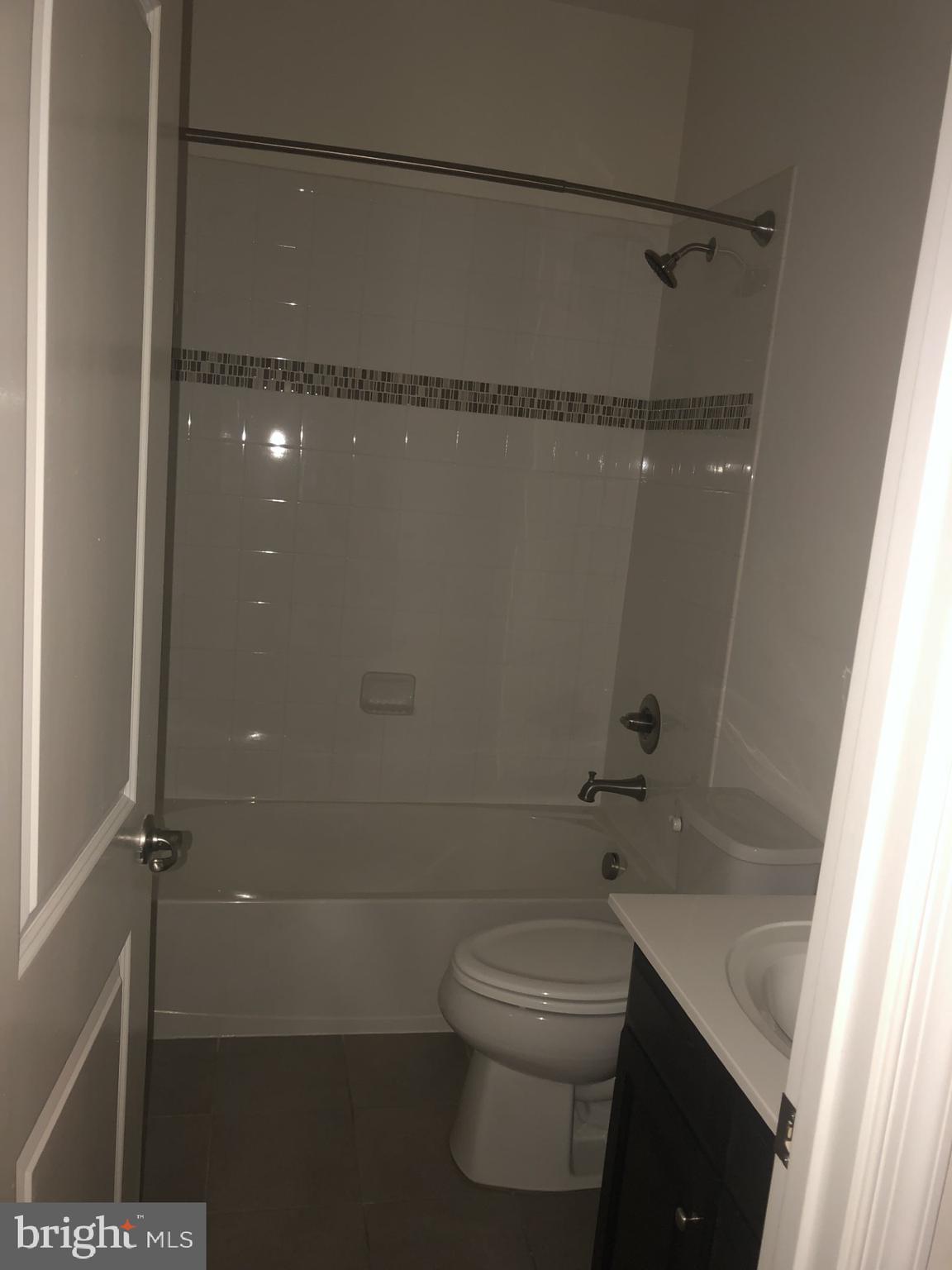 1728 Lantern Mews Baltimore, MD 21205 - Photo 9 of 16 a bathroom with a shower a toilet and sink