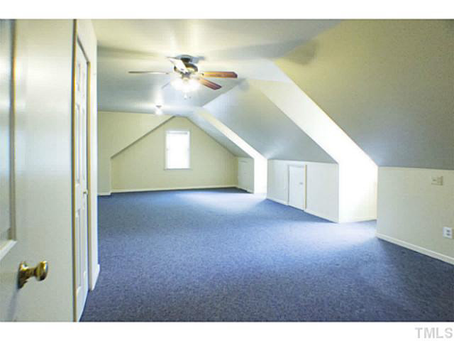 107 Kings Fork Road Cary, NC 27511 - Photo 20 of 25 Large bonus room with stairs down to the back hall