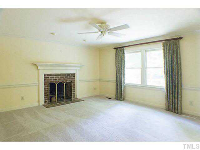 107 Kings Fork Road Cary, NC 27511 - Photo 9 of 25 Family room with masonry fireplace/gas logs.