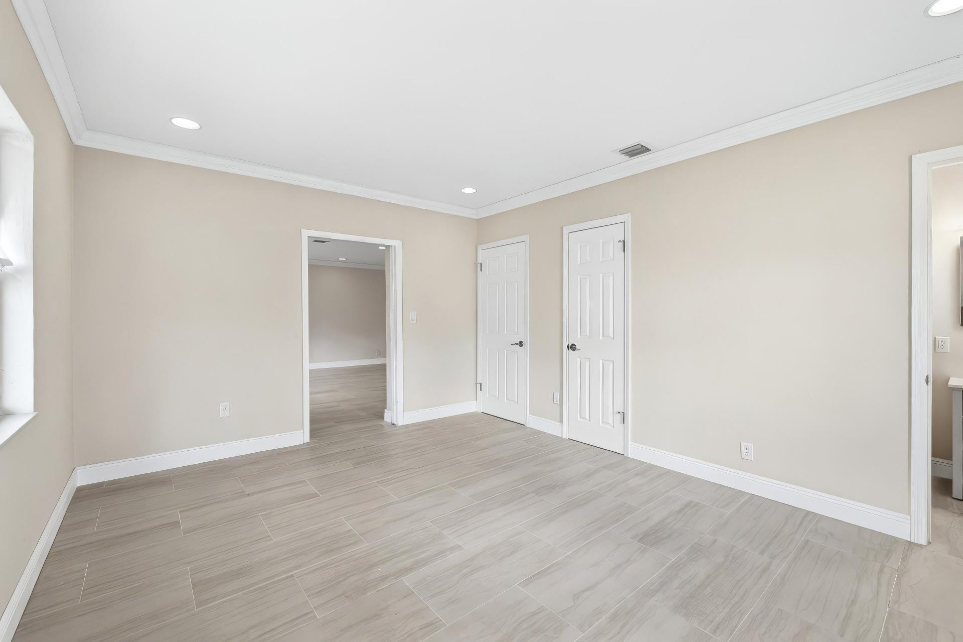 2000 Northeast 17th Street Fort Lauderdale, FL 33305 - Photo 17 of 44 a view of an empty room with wooden floor