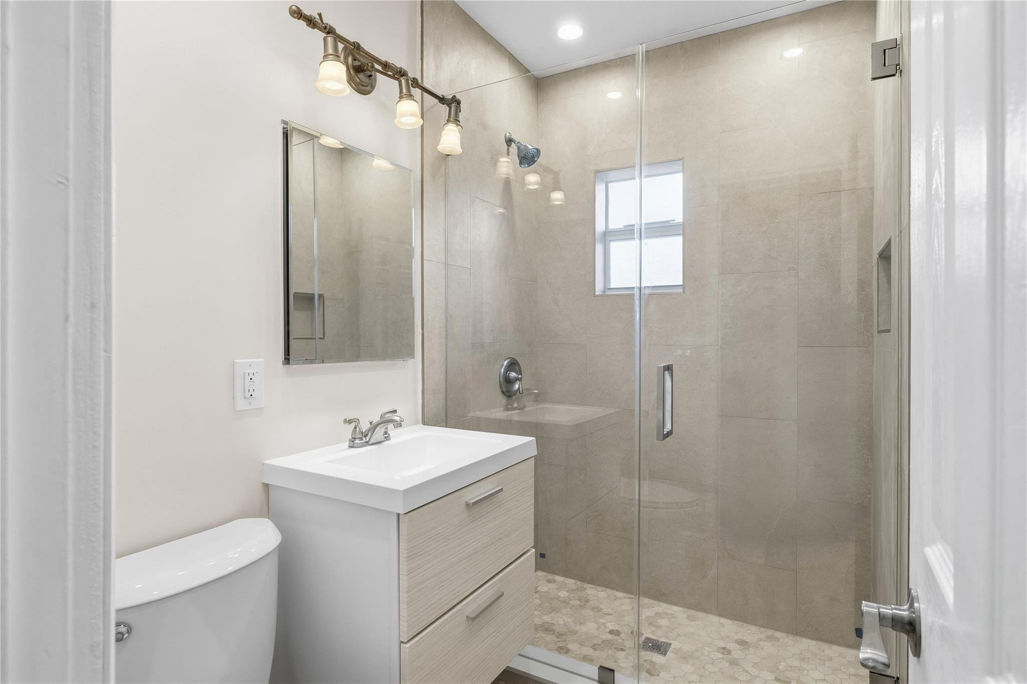 2000 Northeast 17th Street Fort Lauderdale, FL 33305 - Photo 19 of 44 a bathroom with a sink toilet and shower