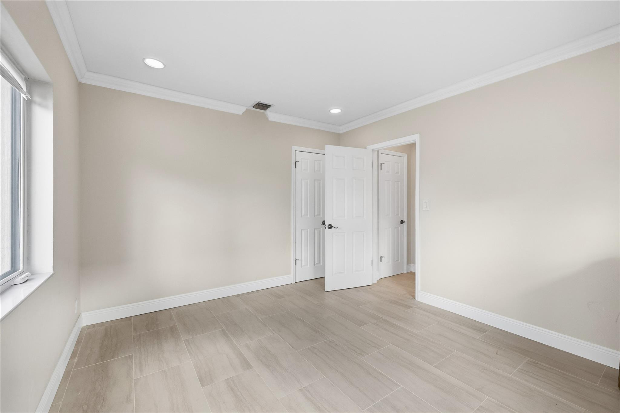 2000 Northeast 17th Street Fort Lauderdale, FL 33305 - Photo 21 of 44 wooden floor in an empty room with a window