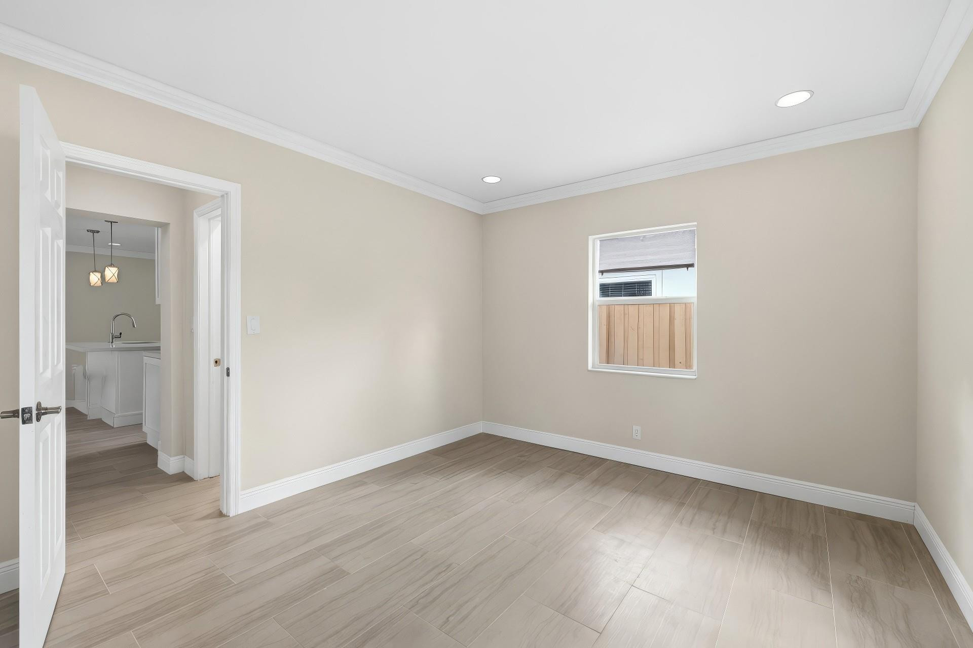 2000 Northeast 17th Street Fort Lauderdale, FL 33305 - Photo 22 of 44 an empty room with wooden floor and a window