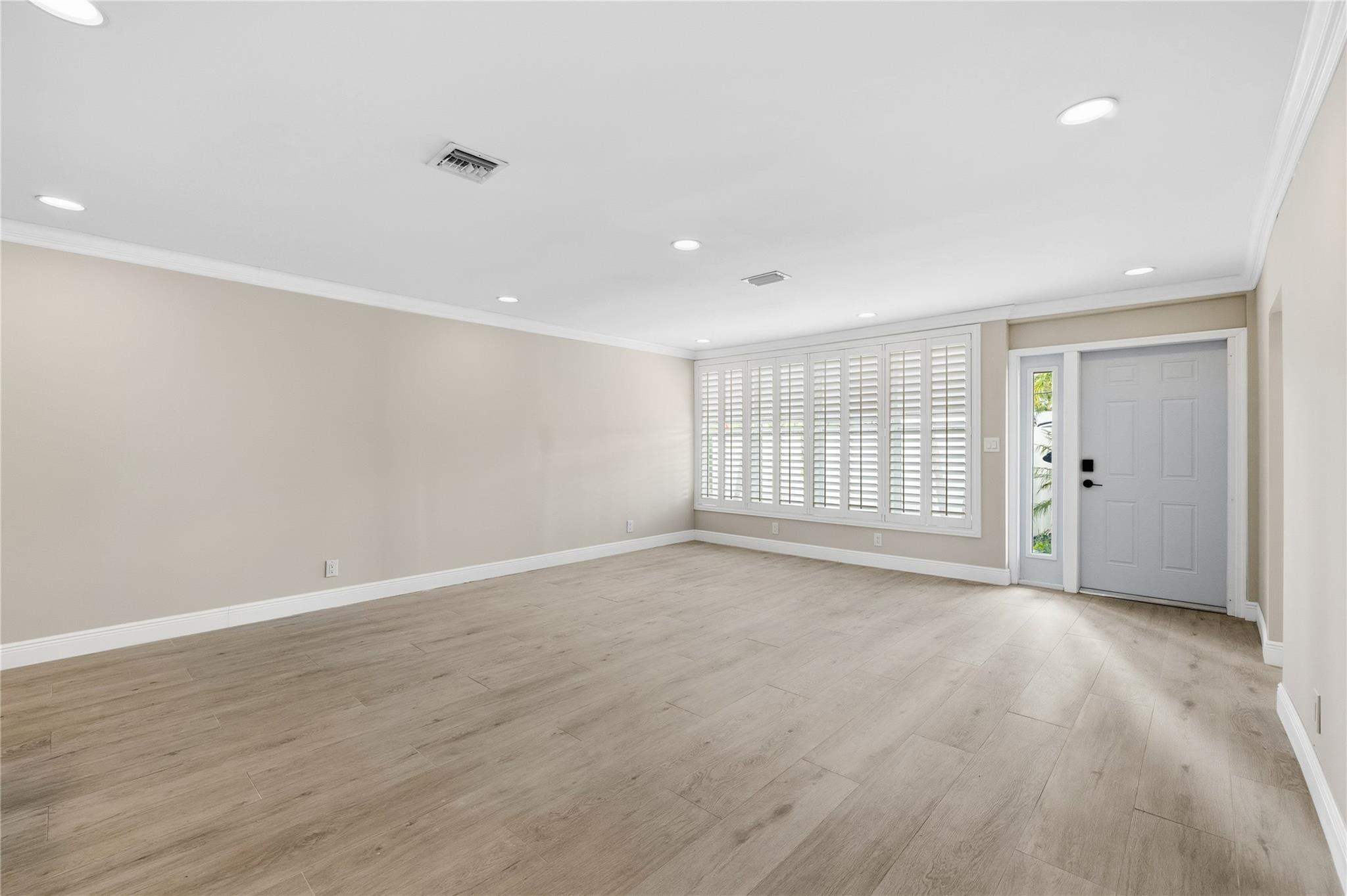 2000 Northeast 17th Street Fort Lauderdale, FL 33305 - Photo 24 of 44 a view of an empty room with wooden floor and window