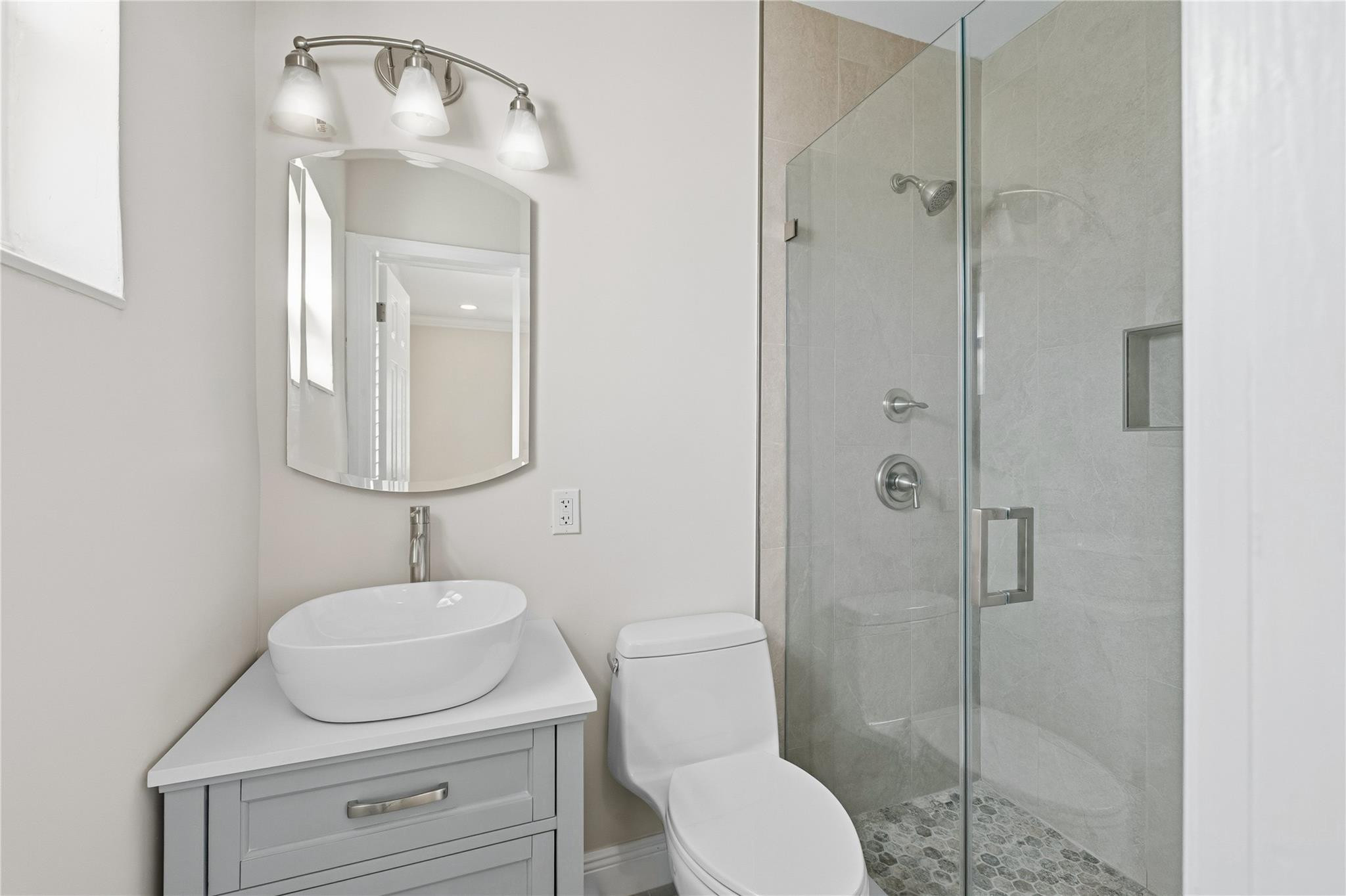 2000 Northeast 17th Street Fort Lauderdale, FL 33305 - Photo 30 of 44 a bathroom with a toilet sink and shower