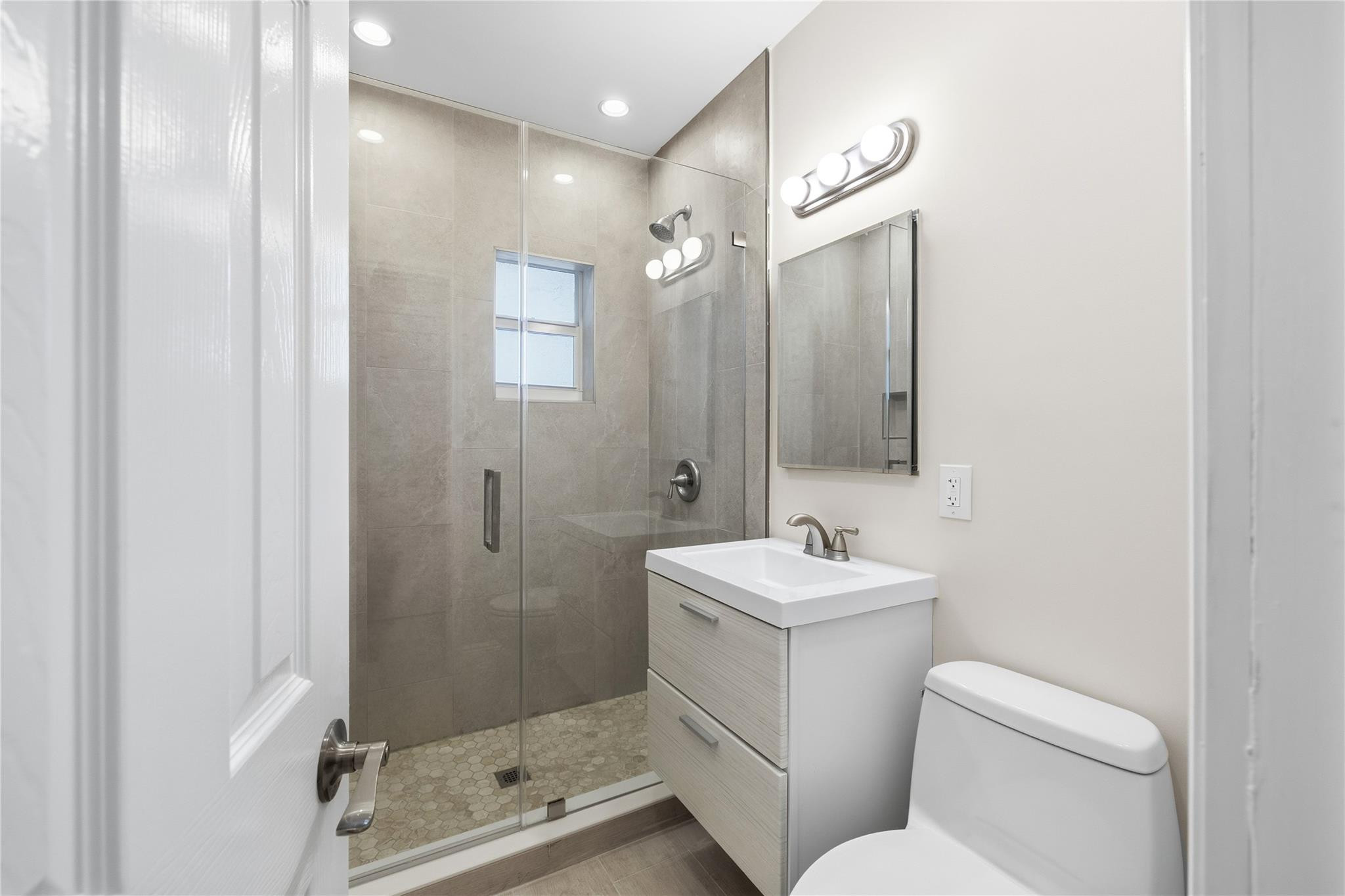 2000 Northeast 17th Street Fort Lauderdale, FL 33305 - Photo 31 of 44 a bathroom with a sink toilet and shower