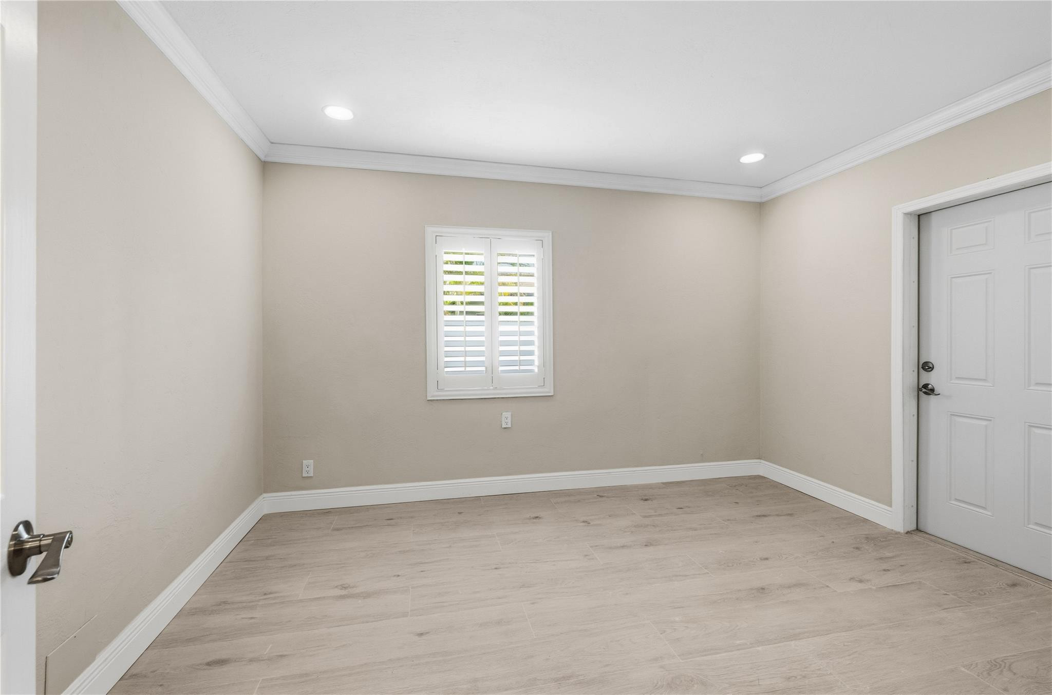 2000 Northeast 17th Street Fort Lauderdale, FL 33305 - Photo 32 of 44 wooden floor in an empty room with a window