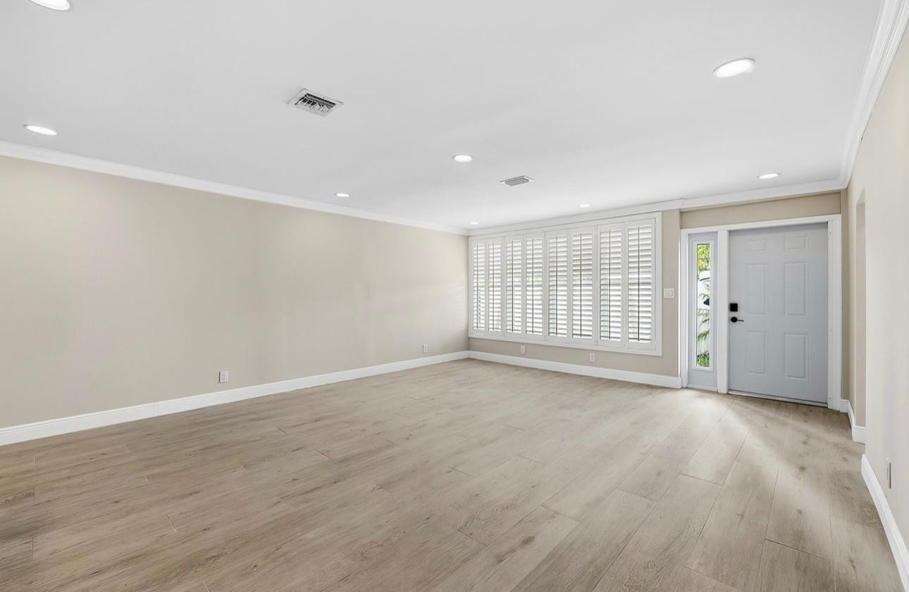 2000 Northeast 17th Street Fort Lauderdale, FL 33305 - Photo 34 of 44 a view of an empty room with wooden floor and window