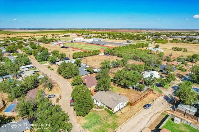 an aerial view of residential building and lake