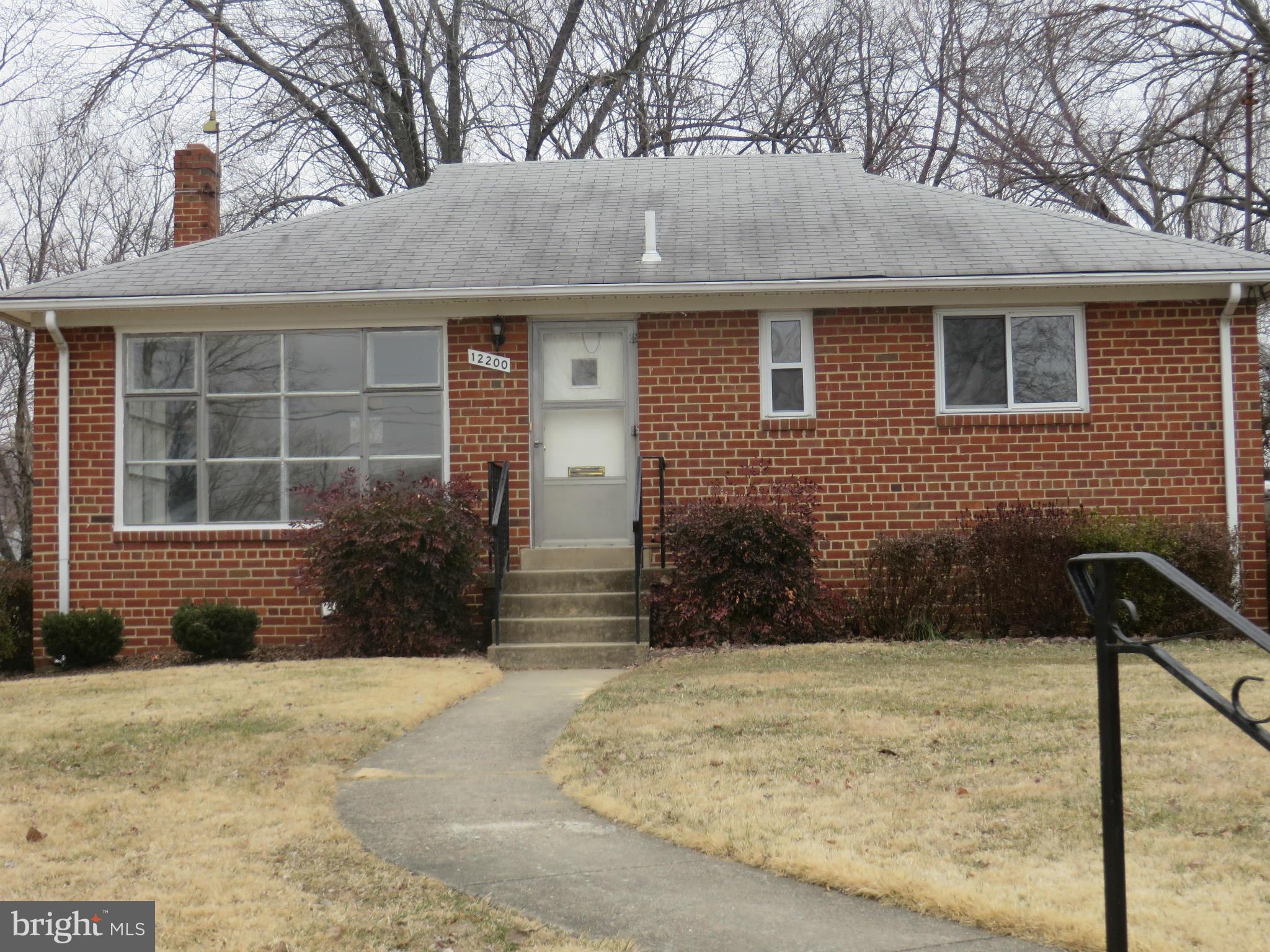 12200 Edgemont Street Silver Spring, MD 20902 - Photo 1 of 12 a front view of a house with a yard