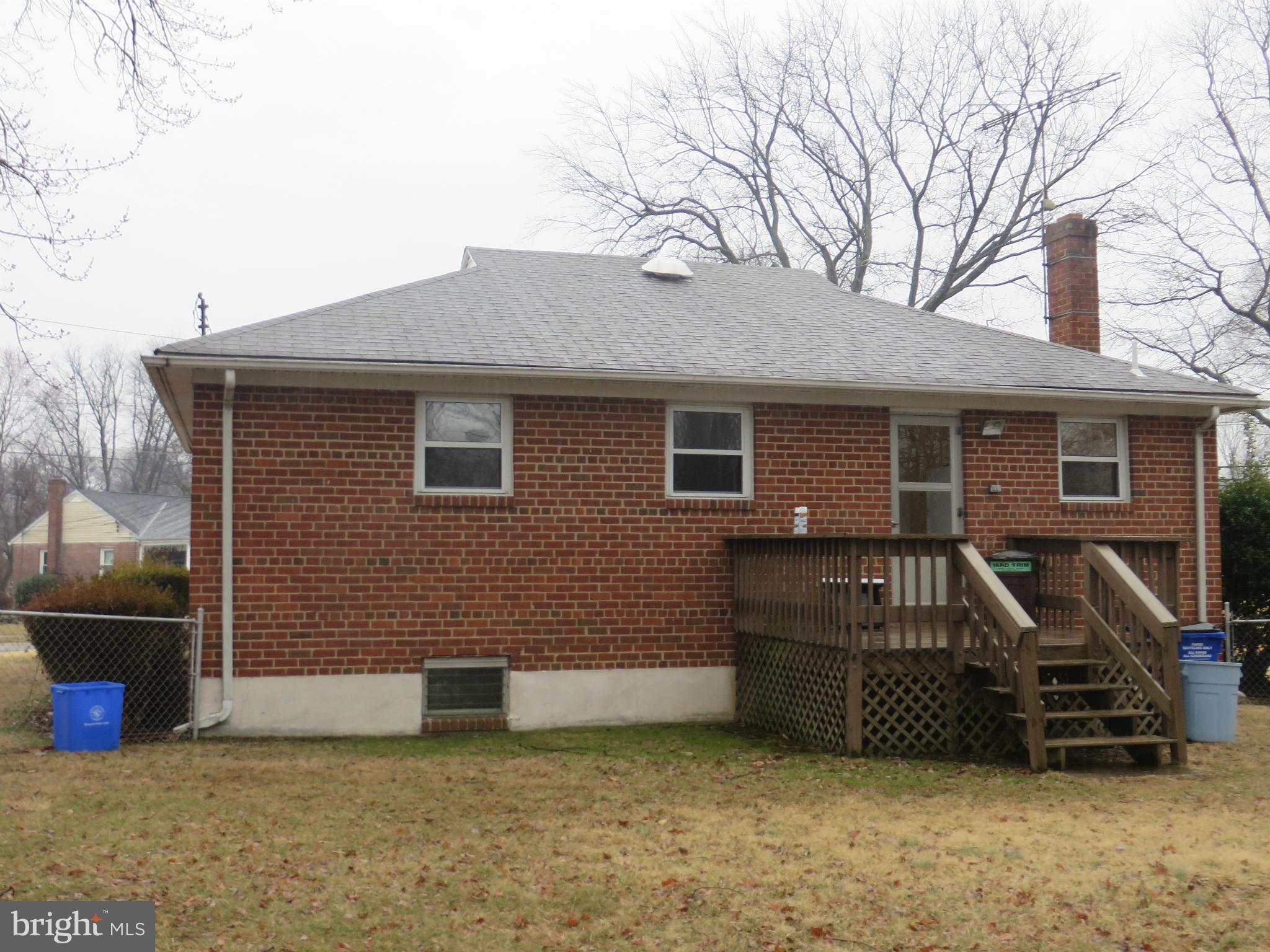 12200 Edgemont Street Silver Spring, MD 20902 - Photo 2 of 12 a view of a house with a barbeque and wooden fence